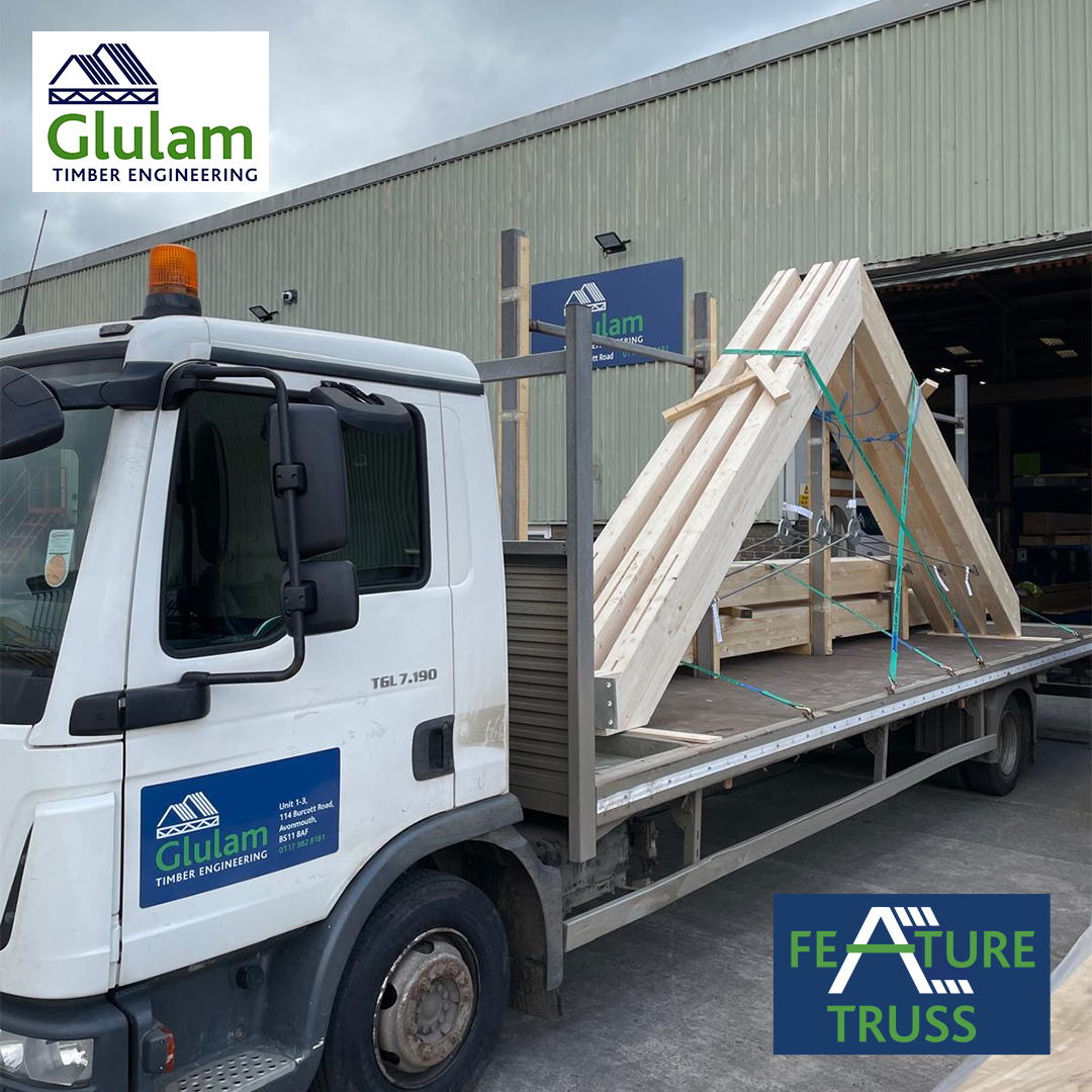 Flat bed lorry with glulam beams on back