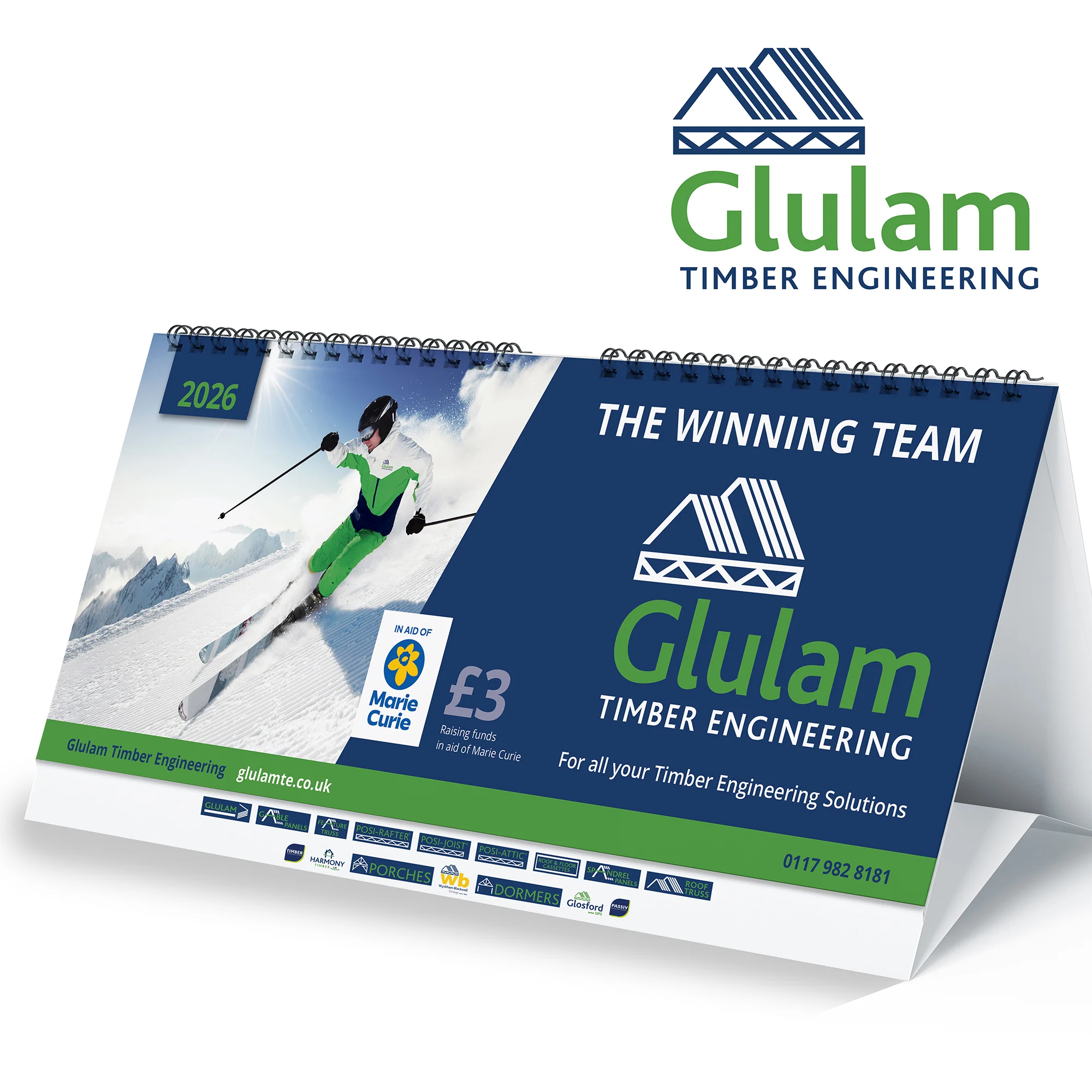 A calendar graphic with a man skiing on the front cover with the Glulam logo on the side.